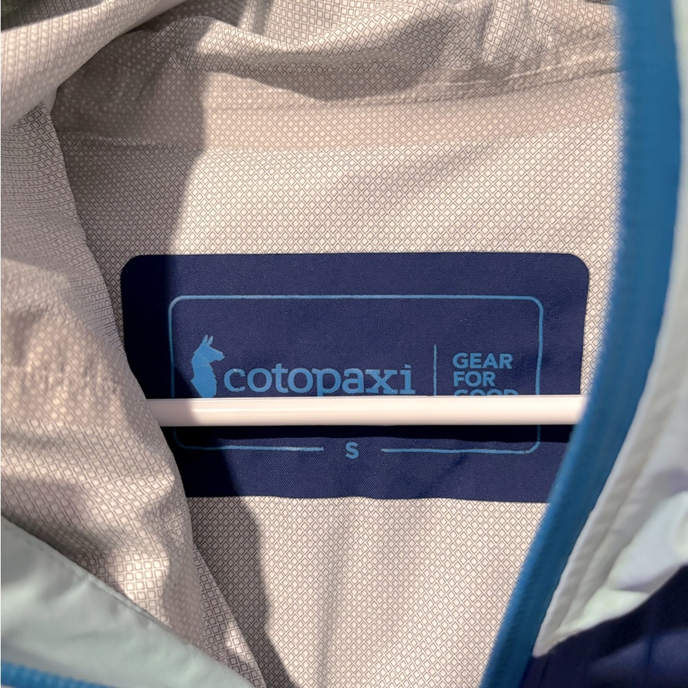 Cotopaxi lightweight waterproof wind breaker